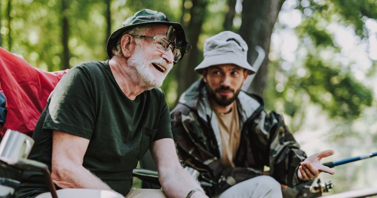 Two men laughing while fishing
